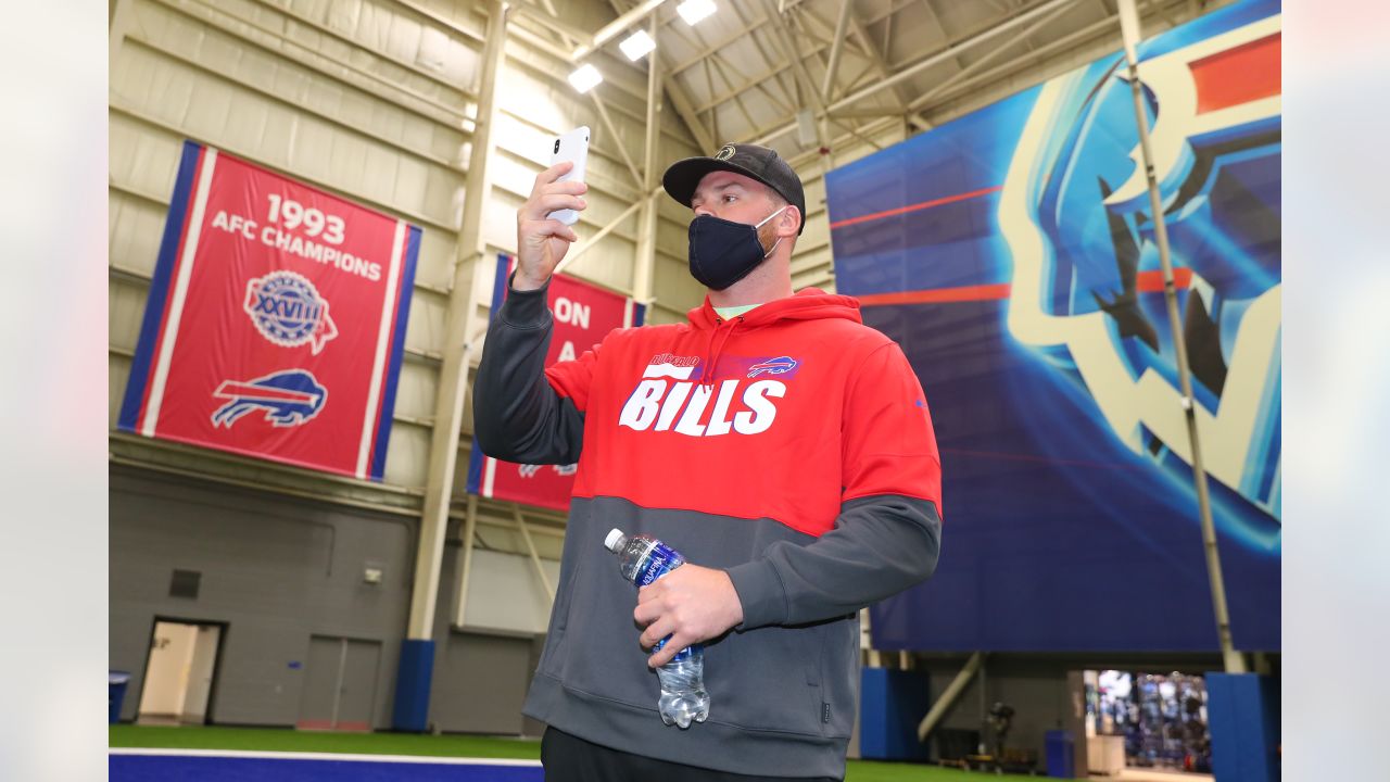 Bills draft pick Spencer Brown celebrates by jumping through table