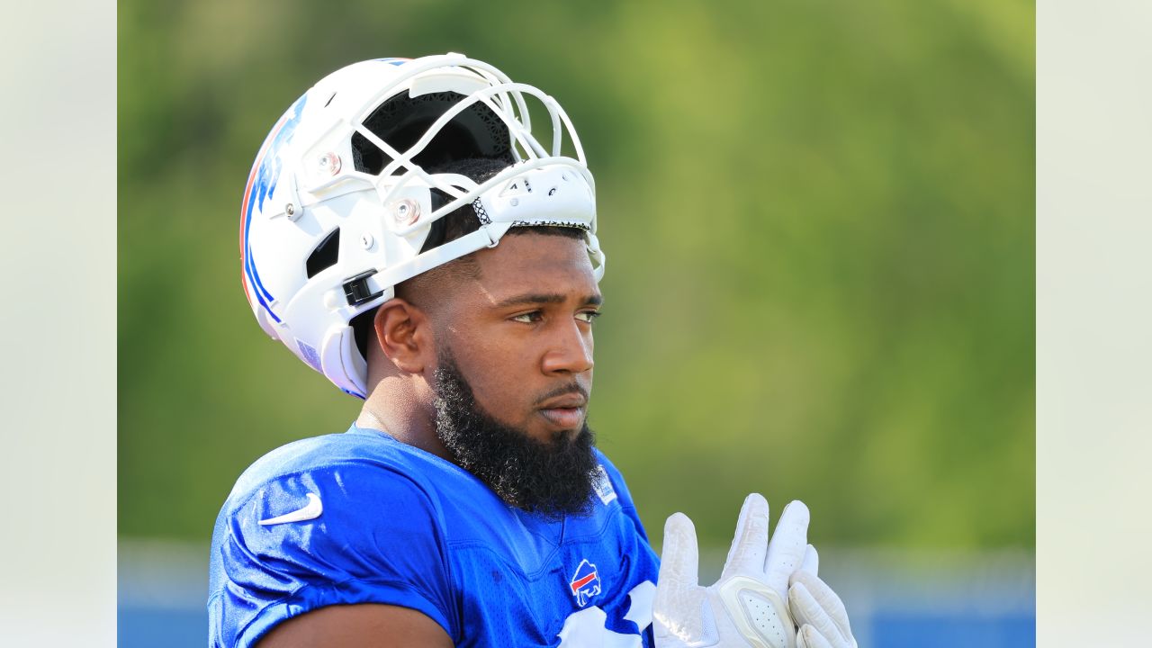 Buffalo Bills defensive tackle Tim Settle (99) and Bills defensive tackle  Ed Oliver (91) talk to a TV camera after beating the Kansas City Chiefs in  an NFL football game, Sunday, Oct.