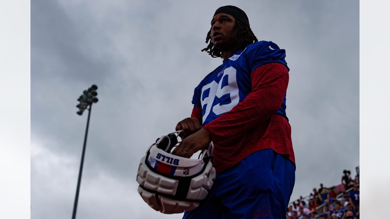 Buffalo Bills defensive tackle Tim Settle (99) and Bills defensive tackle  Ed Oliver (91) talk to a TV camera after beating the Kansas City Chiefs in  an NFL football game, Sunday, Oct.