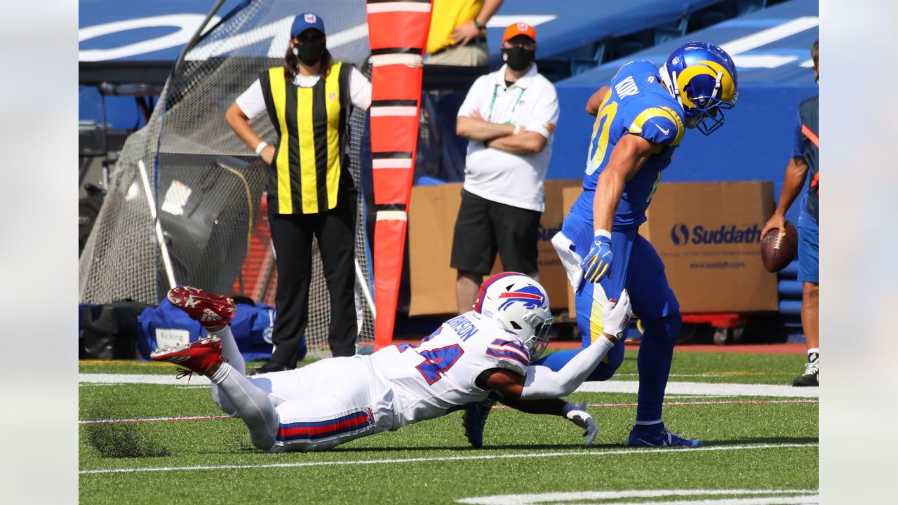 Taron Johnson of the Buffalo Bills tackles Cooper Kupp of the Los