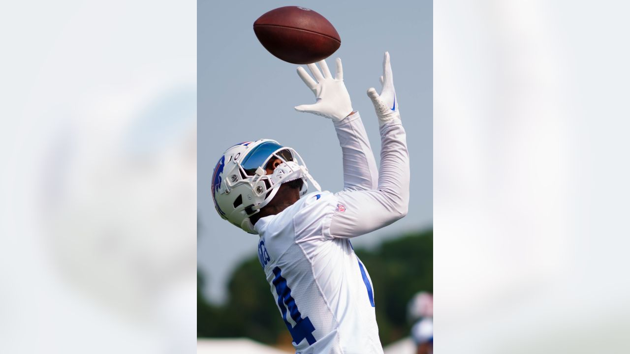 FILE - Buffalo Bills quarterback Josh Allen (17) signs a bottle of barbecue  sauce for a fan after practice at the NFL football team's training camp in  Pittsford, N.Y., Thursday, July 27