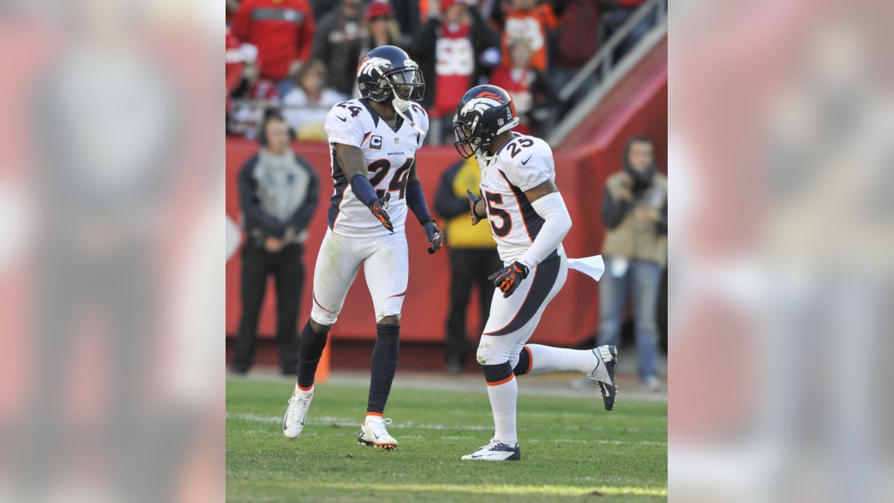 Denver Broncos CB Champ Bailey (L) hangs his head alongside