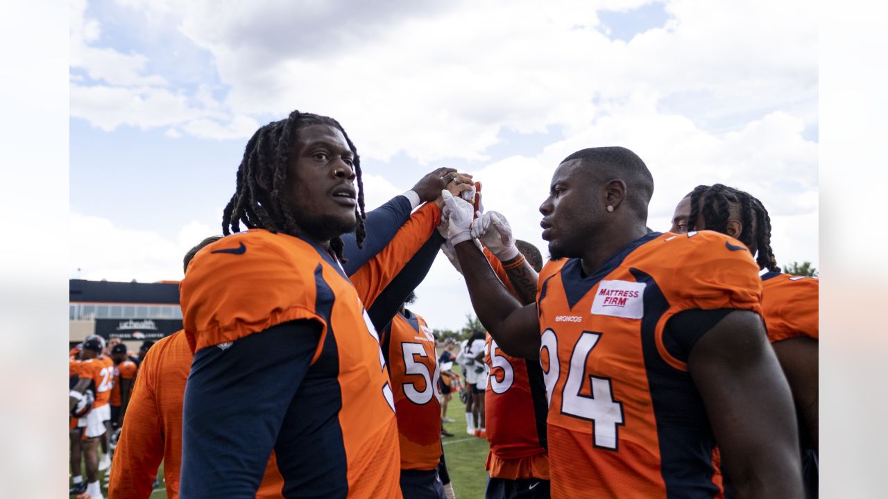 Denver Broncos linebacker Aaron Patrick warms up before a