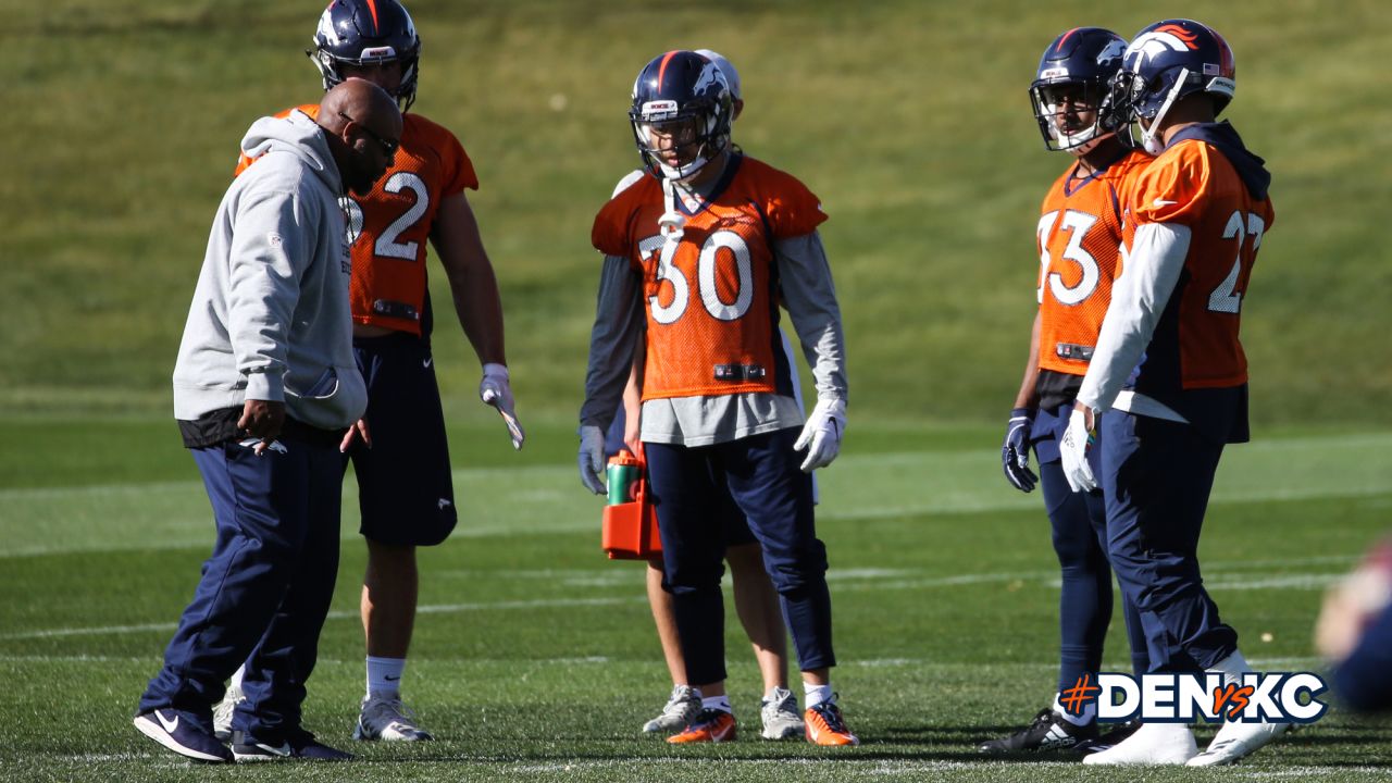 Running Backs Coach Curtis Modkins with fullback Andy Janovich and running backs Phillip Lindsay, Jeremy McNichols and Devontae Booker during practice on October 26, 2018 at UCHealth Training Center.