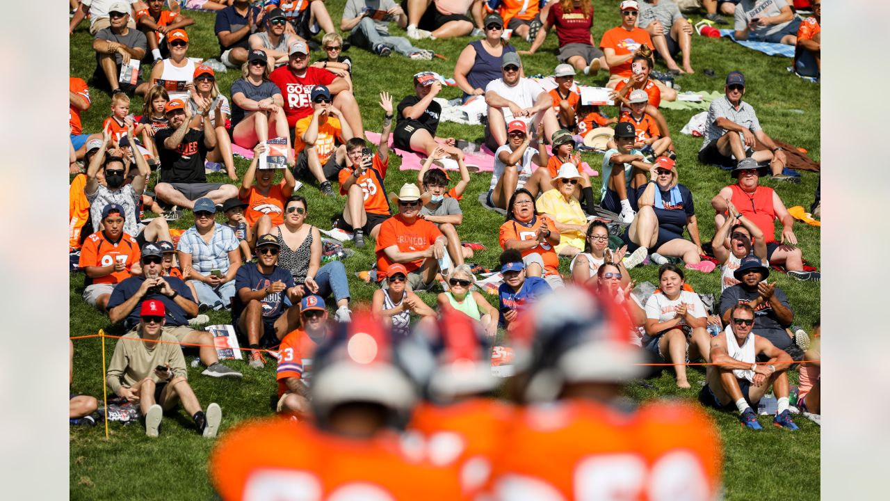 Denver Broncos free safety Justin Simmons takes off his jersey to meet  coronavirus requirements after taking part in drills at NFL football  training camp, Wednesday, July 28, 2021, in Englewood, Colo. (AP