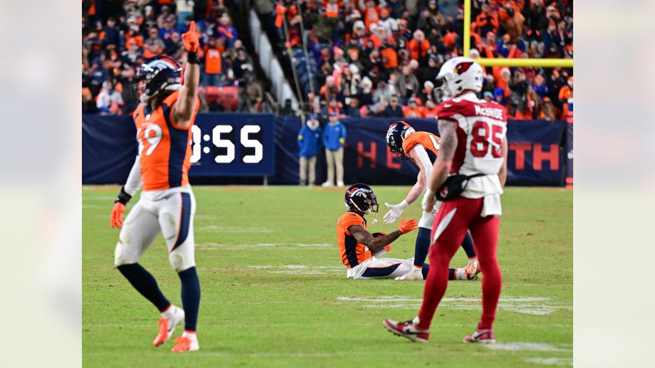 DENVER, CO - DECEMBER 18: Denver Broncos cornerback Pat Surtain II (2) goes  up to grab an interception during an NFL game between the Arizona Cardinals  and the Denver Broncos on December