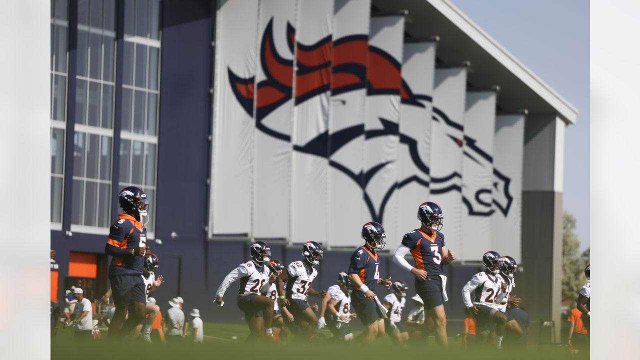 Denver Broncos quarterback Teddy Bridgewater (5) and Denver Broncos  quarterback Drew Lock (3) taking part in drills at an NFL football training  camp at team headquarters Saturday, July 31, 2021, in Englewood