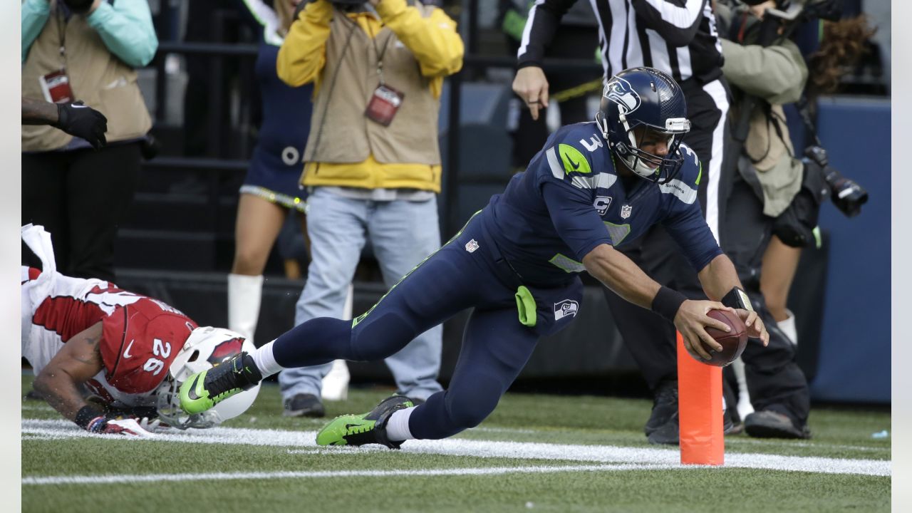 Seattle Seahawks quarterback Russell Wilson holds the Vince