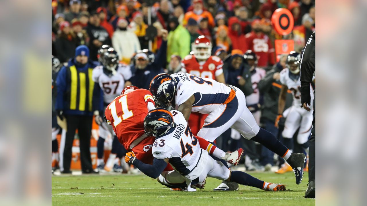 Denver Broncos running back Mike Bell (20) is tackled by Kansas City Chiefs  linebacker Keyaron Fox (97) during the second half of an NFL football game  in Kansas City, Mo., Thursday, Nov.