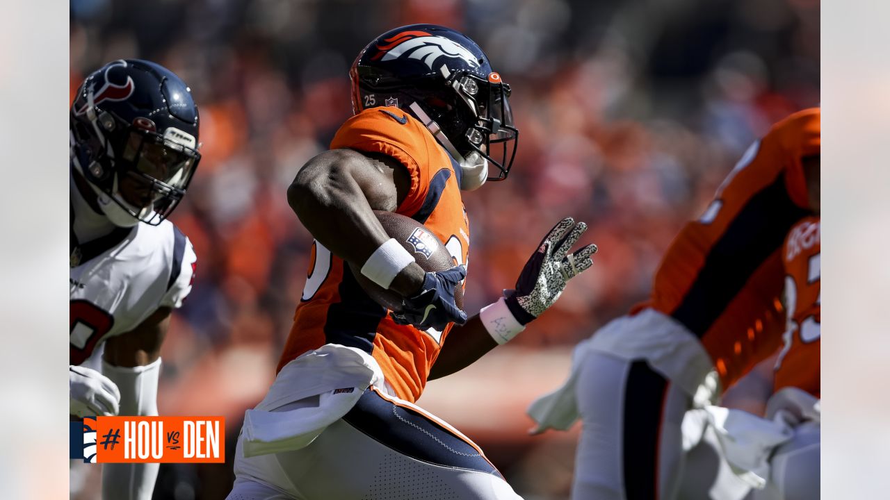 DENVER, CO - DECEMBER 19: Denver Broncos running back Melvin Gordon (25)  carries the ball during a game between the Denver Broncos and the  Cincinnati Bengals at Empower Field at Mile High