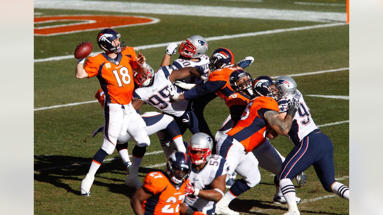 Denver Broncos Peyton Manning throws against the New England Patriots  during the AFC Championship game at Sport Authority Field at Mile High in  Denver on January 24, 2016. Denver advances to Super