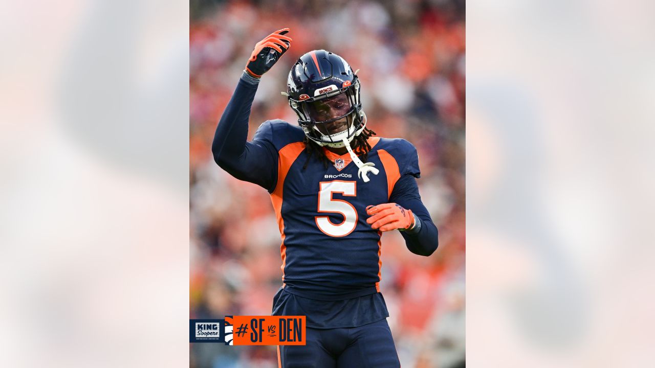 Denver Broncos punter Corliss Waitman (17) punts against the Los