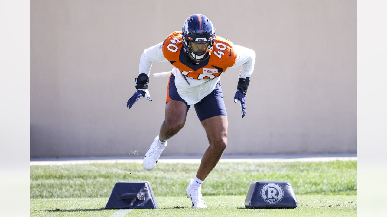 Denver Broncos running back Mike Boone looks to his teammates while sitting  on the bench with his helmet off against the Seattle Seahawks in an NFL  football game, Monday, Sept. 12, 2022