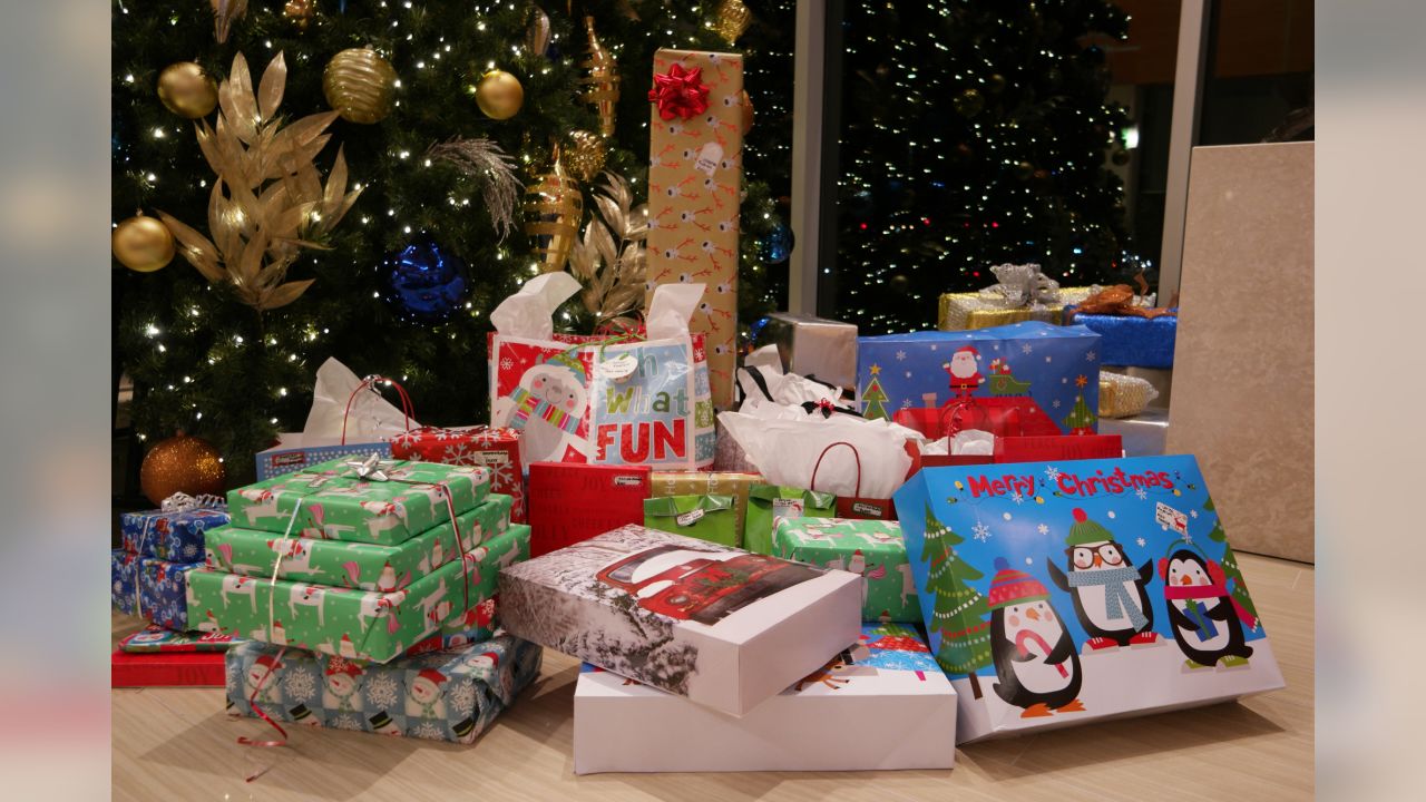 Domata Peko Sr. and his wife Anna and the rest of the defensive linemen hosted families the Pekos adopted for the holidays for a gift-giving experience at UCHealth Training Center on December 21, 2018.