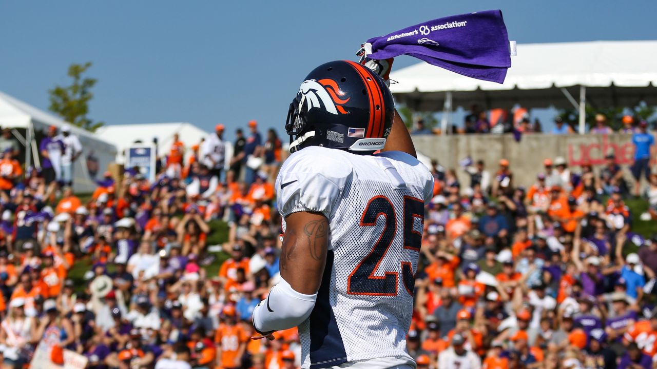 A Seattle Seahawks fan wearing a Russell Wilson jersey waves a towel next  to a Denver Broncos fan wearing a Russell Wilson jersey before an NFL  football game, Monday, Sept. 12, 2022