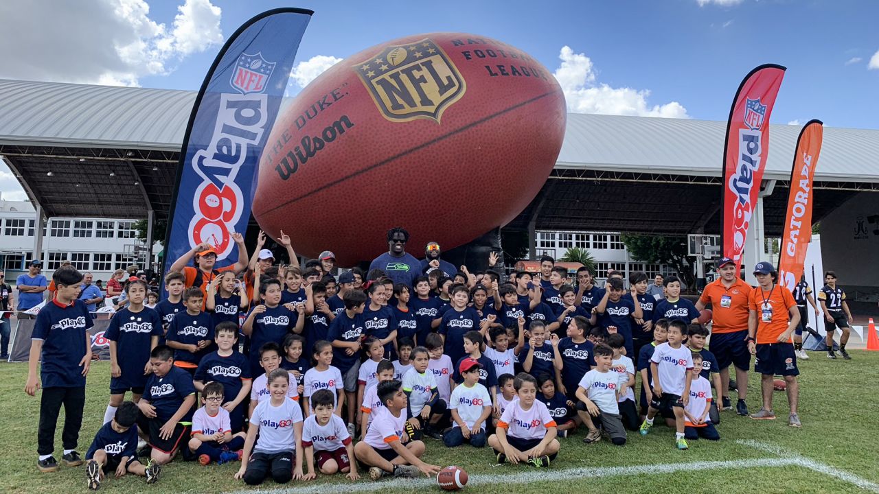 Zach Kerr takes a group photo at the Tochito National Tournament on February 9, 2019, as a player ambassador for the flag football tournament.