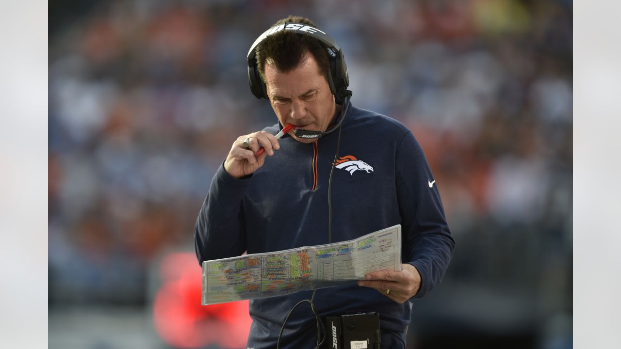 Denver Broncos Von Miller hugs head coach Gary Kubiak after giving Kubiak  the Gatorade bucket on the sidelines in the final minute of the game  against the Carolina Panthers at Super Bowl