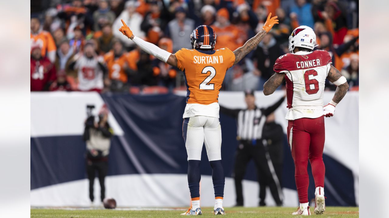 DENVER, CO - DECEMBER 18: Denver Broncos cornerback Pat Surtain II (2) goes  up to grab an interception during an NFL game between the Arizona Cardinals  and the Denver Broncos on December