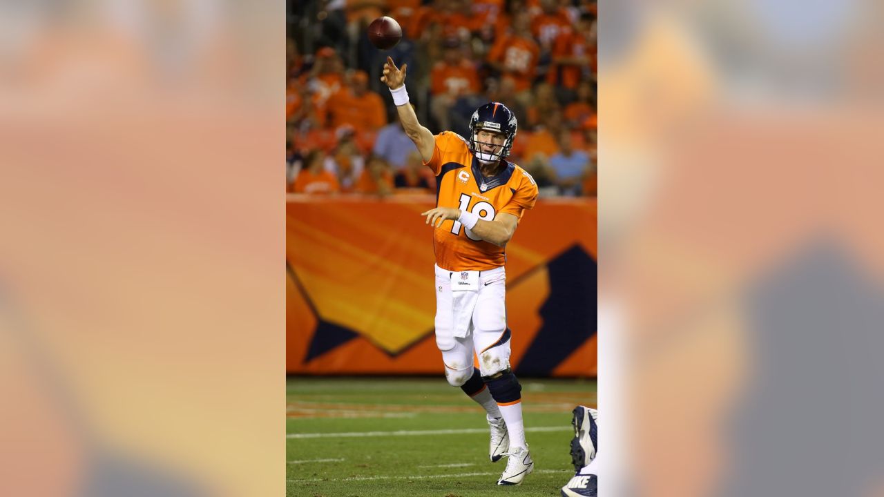 Manning throws 7 TDs as Broncos stampede past defending champion Ravens