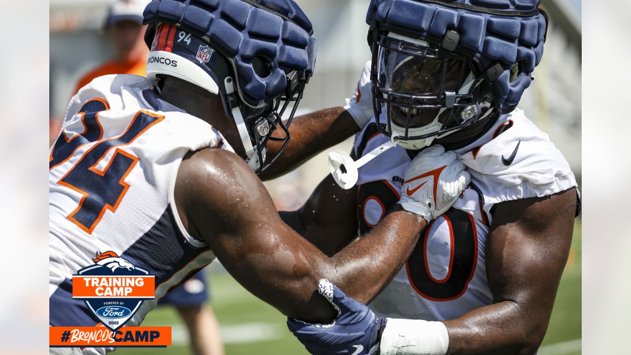 Denver Broncos linebacker Jonathan Kongbo (90) walks off the field