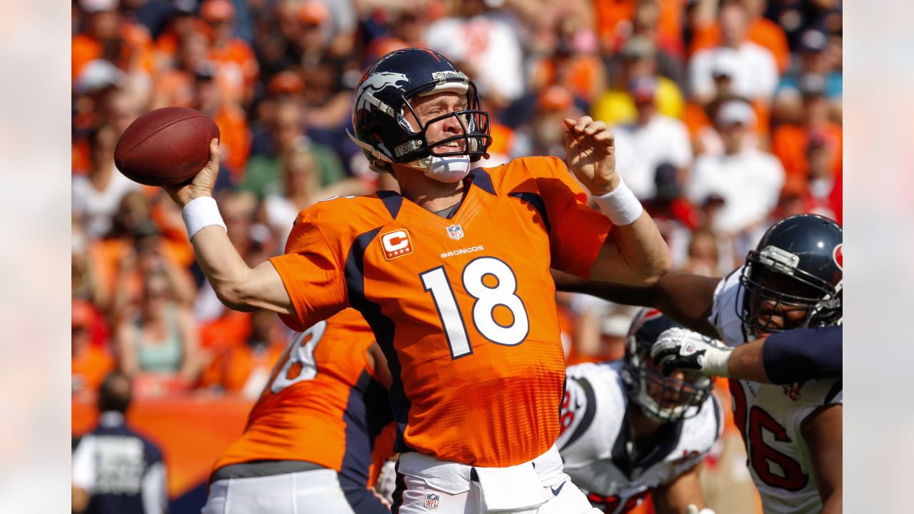 Denver Broncos quarterback Peyton Manning (18) drops back to pass