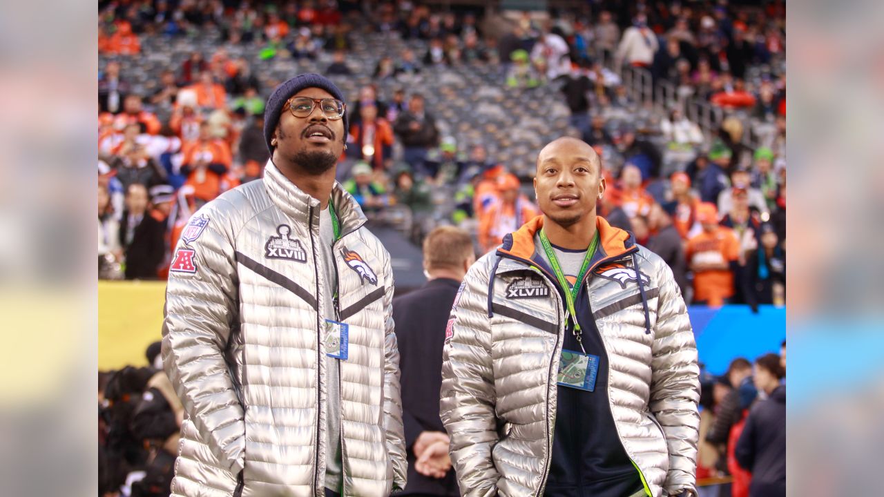 A Seattle Seahawks fan wearing a Russell Wilson jersey waves a towel next  to a Denver Broncos fan wearing a Russell Wilson jersey before an NFL  football game, Monday, Sept. 12, 2022