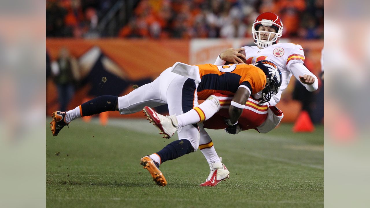 Denver Broncos running back Mike Bell (20) is tackled by Kansas City Chiefs  linebacker Keyaron Fox (97) during the second half of an NFL football game  in Kansas City, Mo., Thursday, Nov.