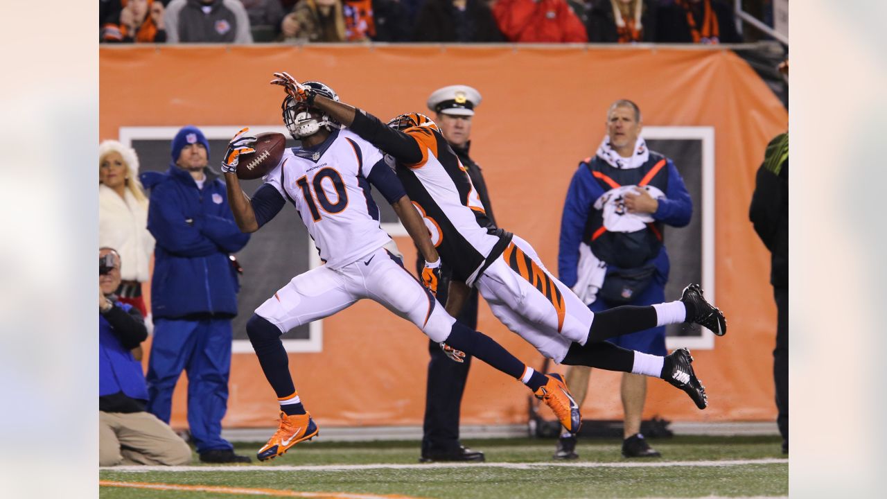 Former Broncos quarterback Peyton Manning fires up Coors Field on jumbotron