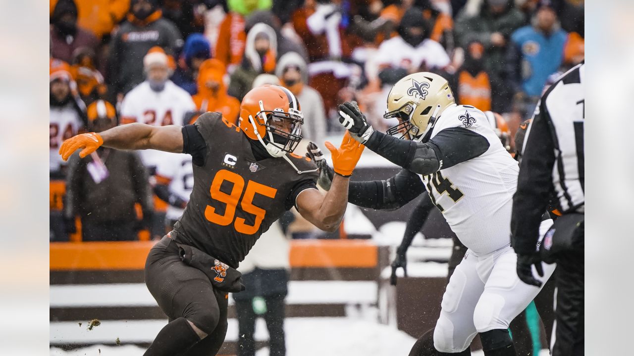 FILE - New Orleans Saints tight end Juwan Johnson (83) attempts to block  Cleveland Browns defensive end Myles Garrett (95) during an NFL football  game, Saturday, Dec. 24, 2022, in Cleveland. As