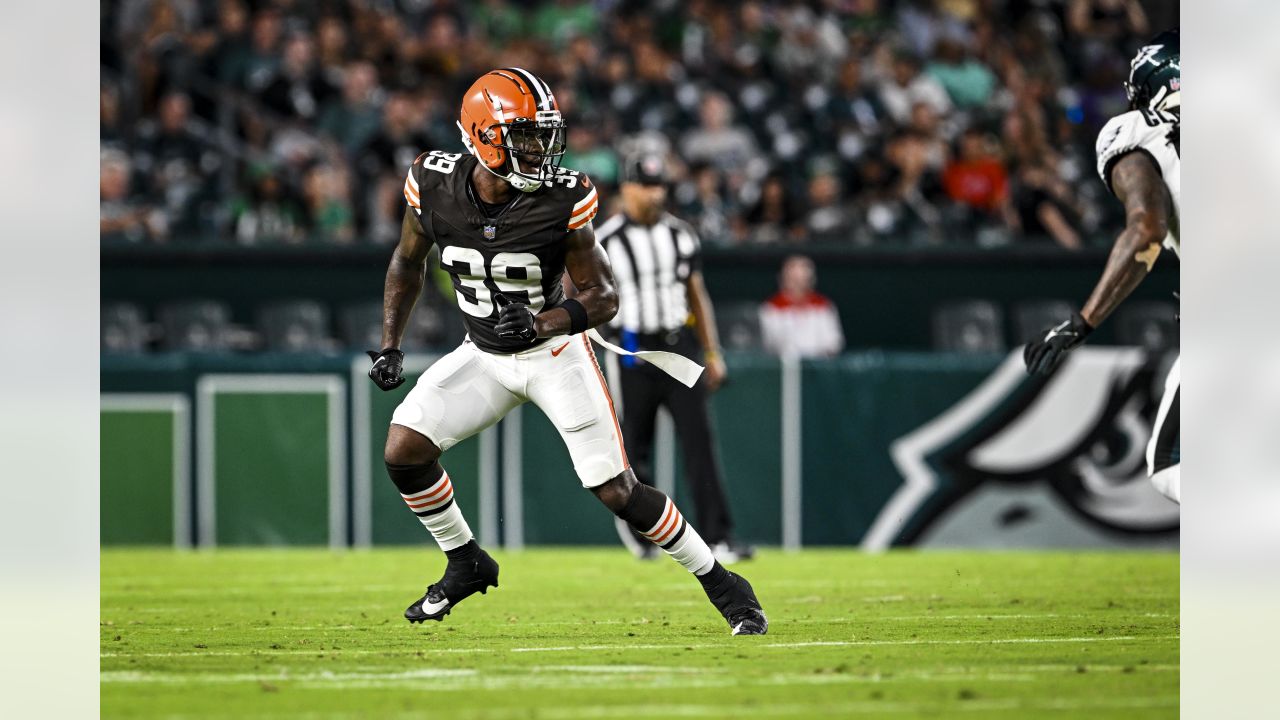 Cleveland Browns cornerback Caleb Biggers celebrates after intercepting a  pass and running it back for a touchdown during the first half of an NFL  preseason football game against the Kansas City Chiefs