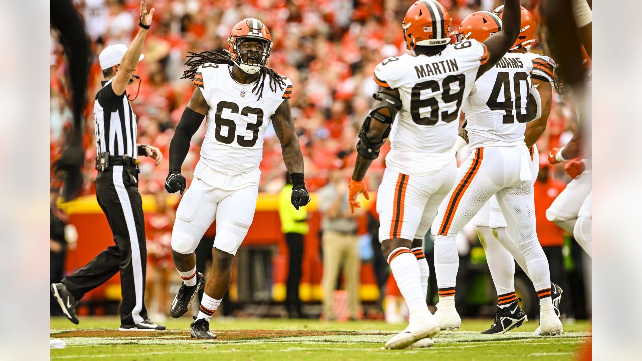 Cleveland Browns cornerback Caleb Biggers celebrates after intercepting a  pass and running it back for a touchdown during the first half of an NFL  preseason football game against the Kansas City Chiefs