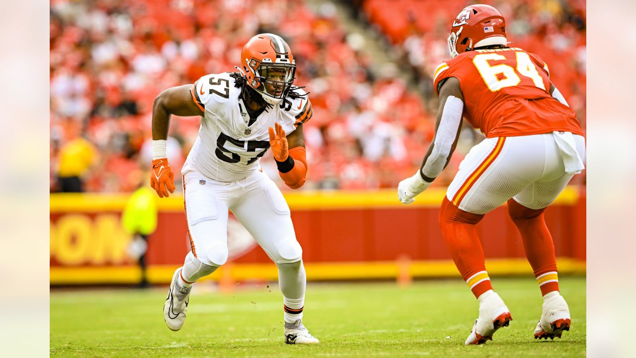 Cleveland Browns cornerback Caleb Biggers celebrates after intercepting a  pass and running it back for a touchdown during the first half of an NFL  preseason football game against the Kansas City Chiefs