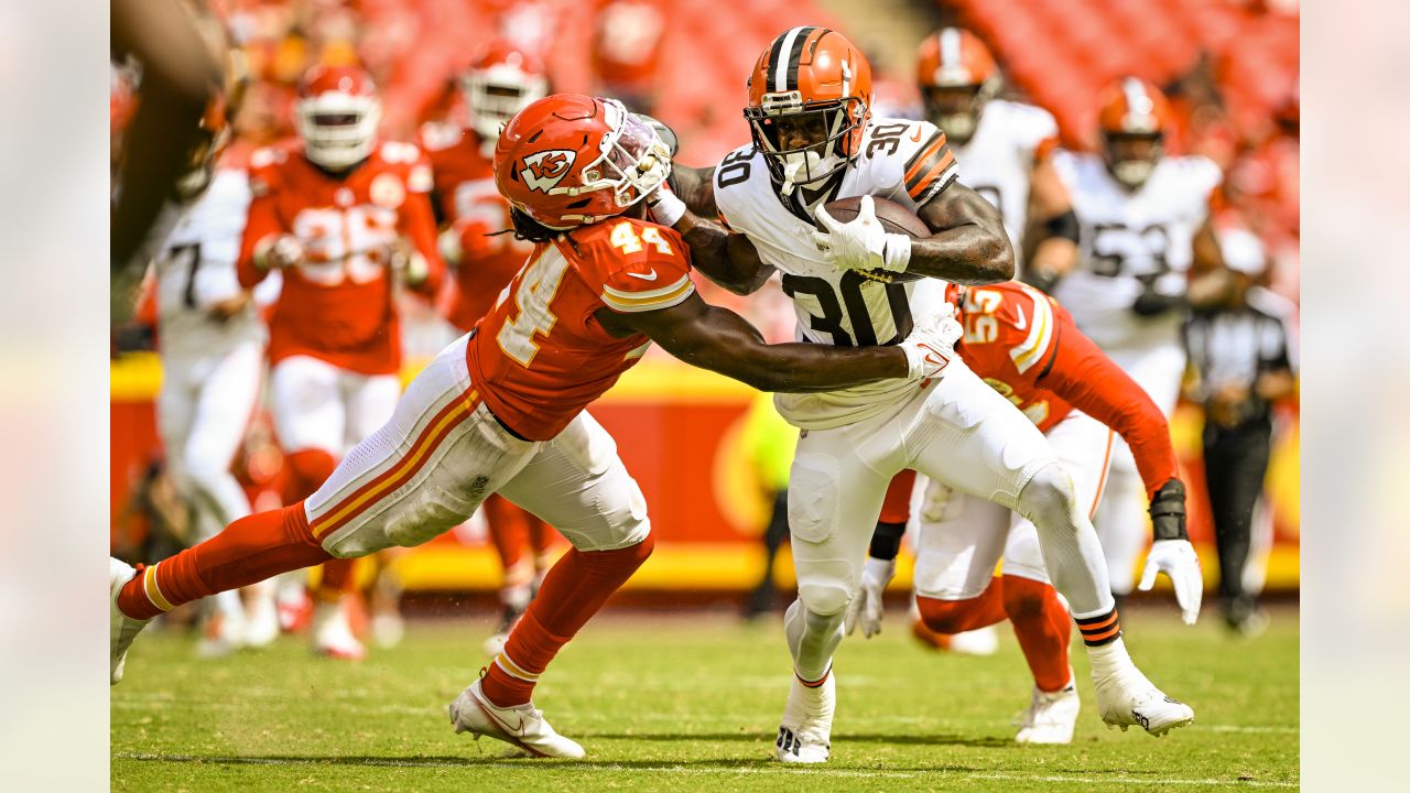 Cleveland Browns cornerback Caleb Biggers celebrates after intercepting a  pass and running it back for a touchdown during the first half of an NFL  preseason football game against the Kansas City Chiefs