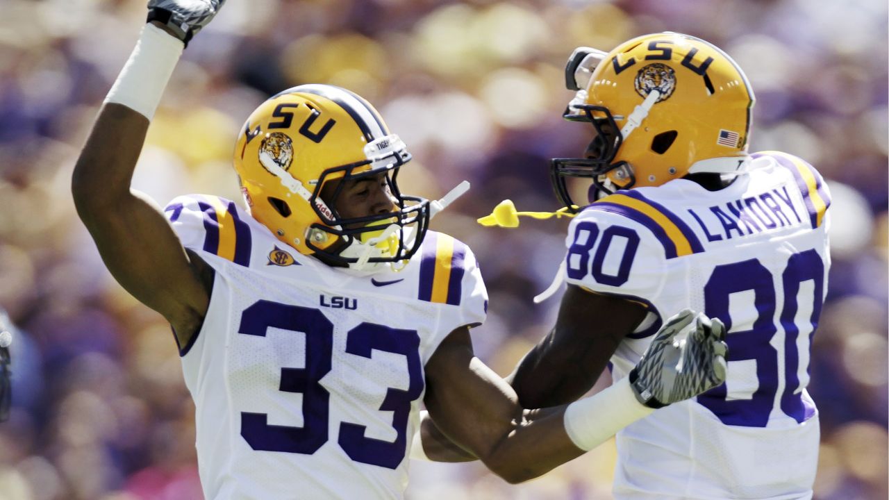 Odell Beckham Jr of the LSU Tigers poses with a jersey after he