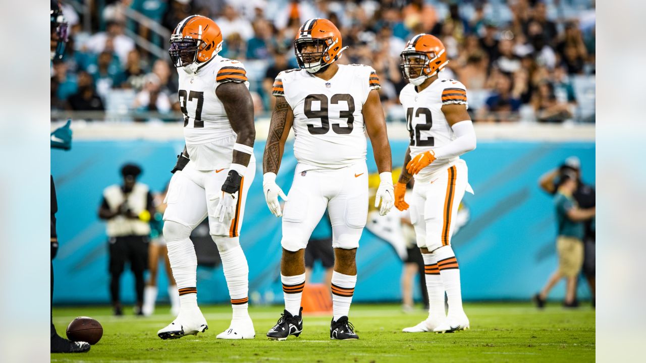 Cleveland Browns defensive tackle Tommy Togiai sits on the bench during an  NFL preseason football game