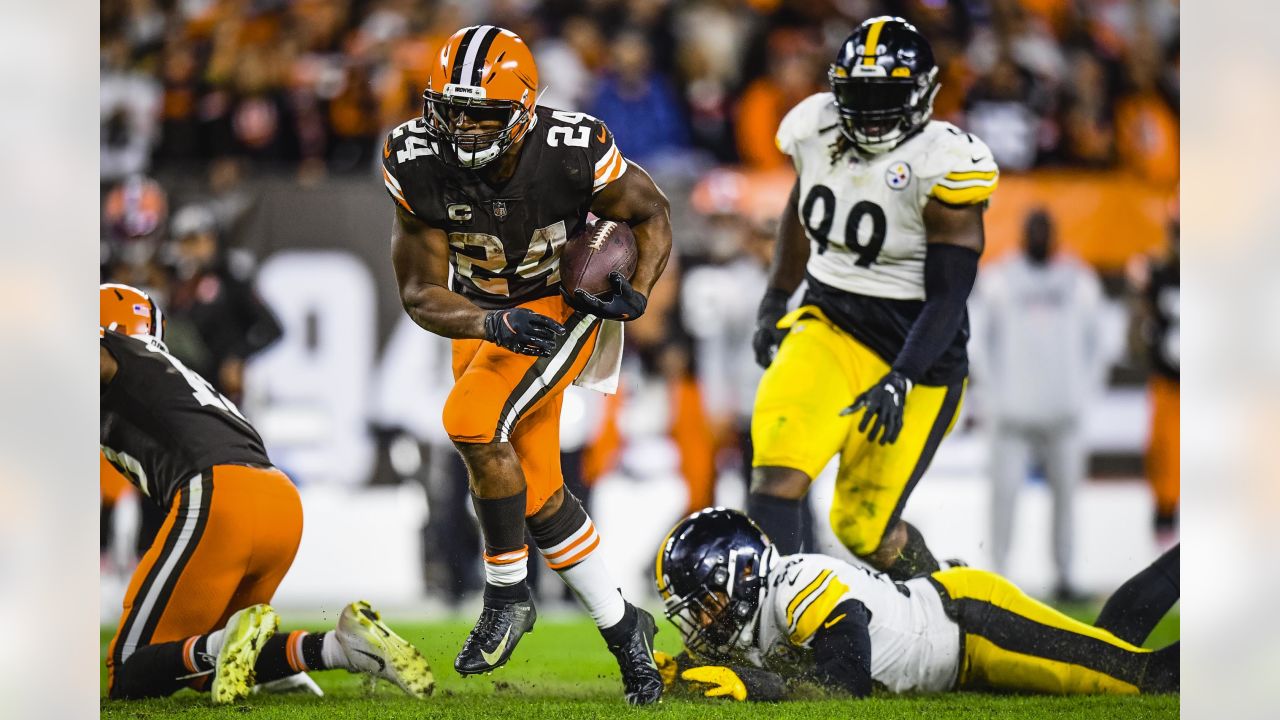 Cleveland Browns running back Nick Chubb (24) breaks a run away from  Pittsburgh Steelers safety Miles Killebrew (28) during the second half an  NFL football game, Monday, Jan. 3, 2022, in Pittsburgh. (