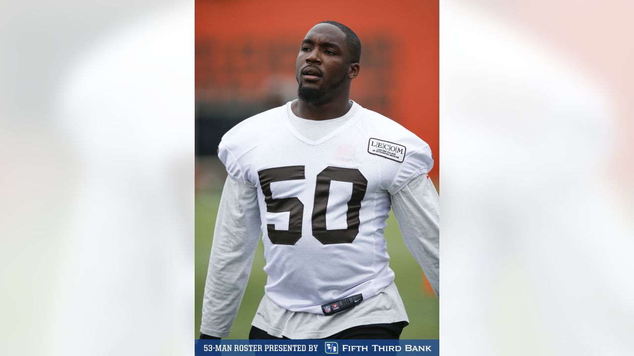 Cleveland Browns defensive end Chris Smith (50) stands with