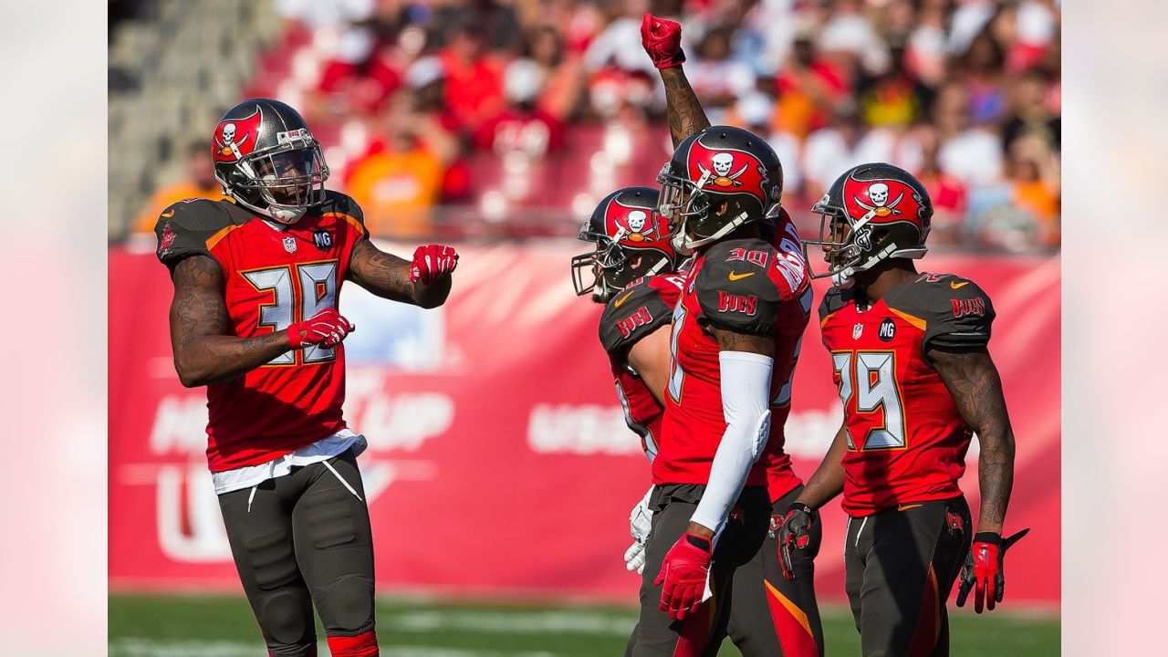 13 SEP 2009: Head Coach Raheem Morris of the Buccaneers in the red shirt  watches the instant replay during the game between the Dallas Cowboys and  the Tampa Bay Buccaneers at Raymond