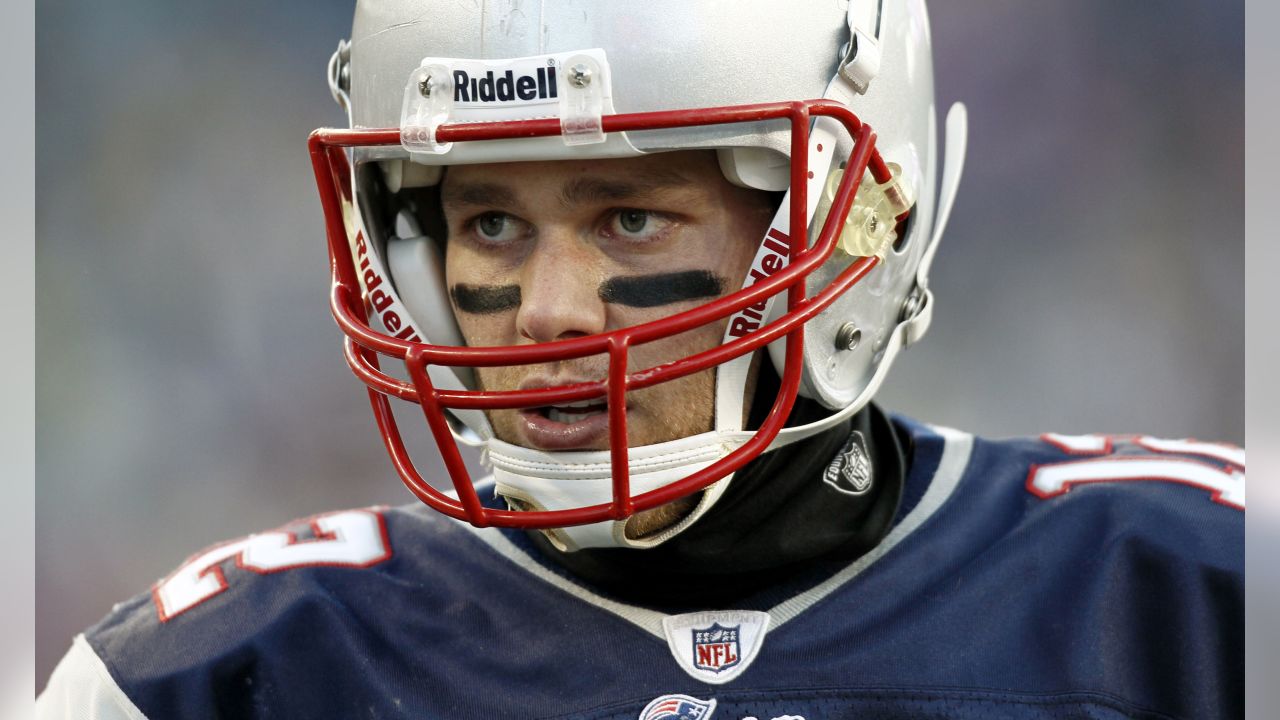 A fan walks by a giant helmet outside the New England Patriots Pro Shop  prior to an NFL football game, Sunday, Sept. 12, 2021, in Foxborough, Mass.  (AP Photo/Steven Senne Stock Photo 