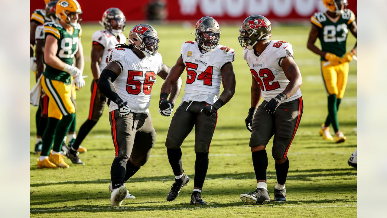 Tampa Bay Buccaneers' William Gholston (92) talks with Tampa Bay Buccaneers'  Rakeem Nunez-Roches (56) before