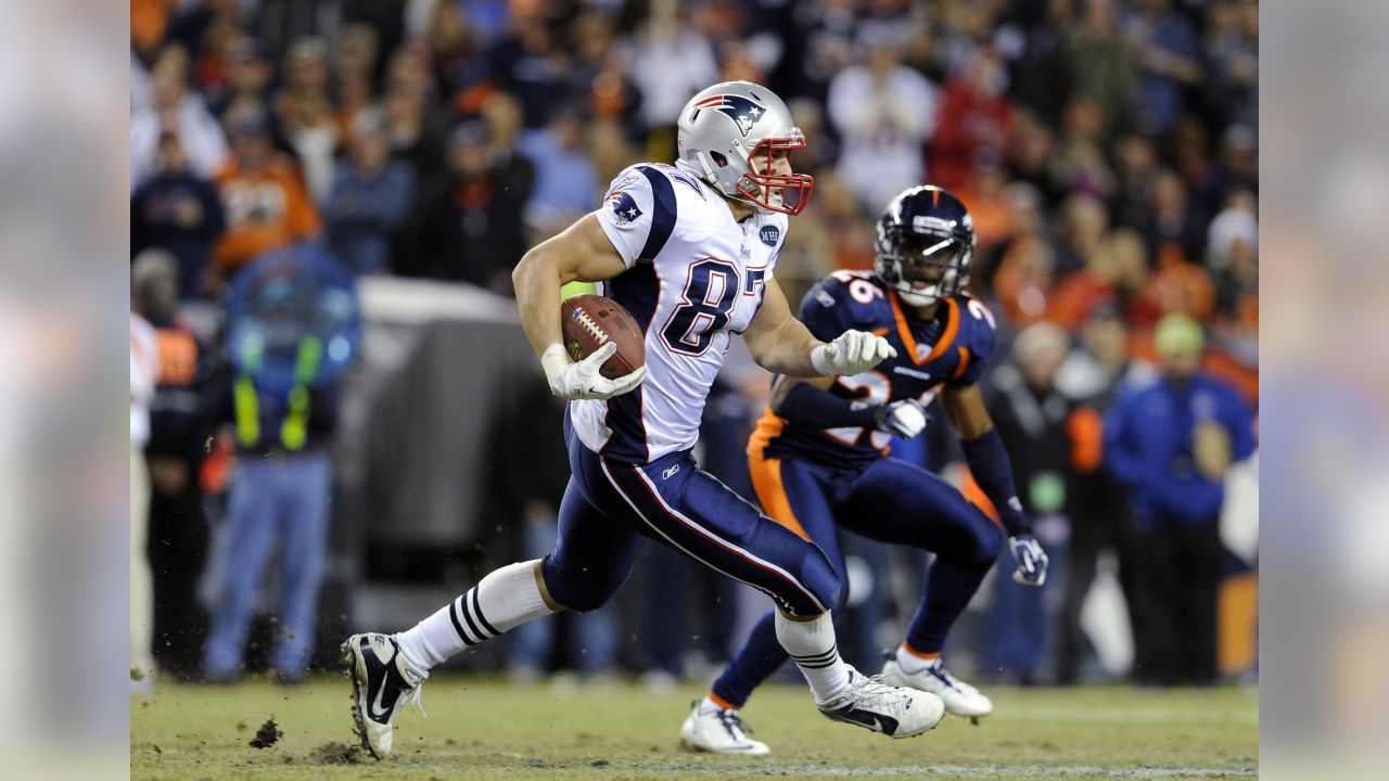 New England Patriots tight end Rob Gronkowski (87) finds open running room  against the Broncos on Sunday evening