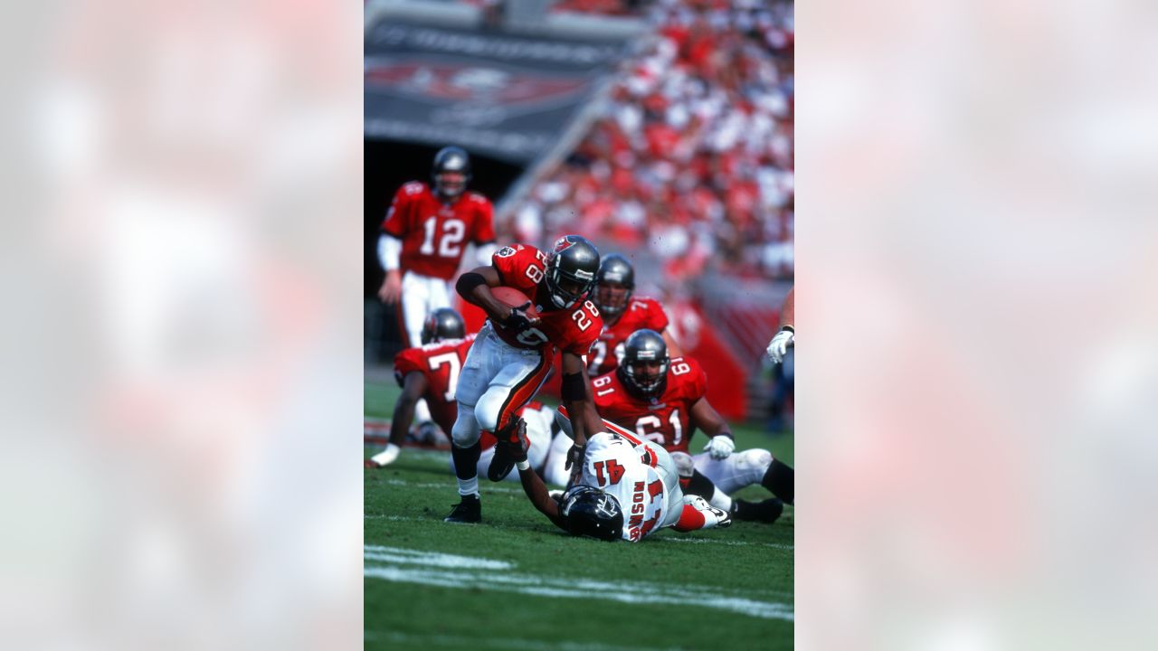 Atlanta Falcons running back Warrick Dunn (28) gets past Cleveland