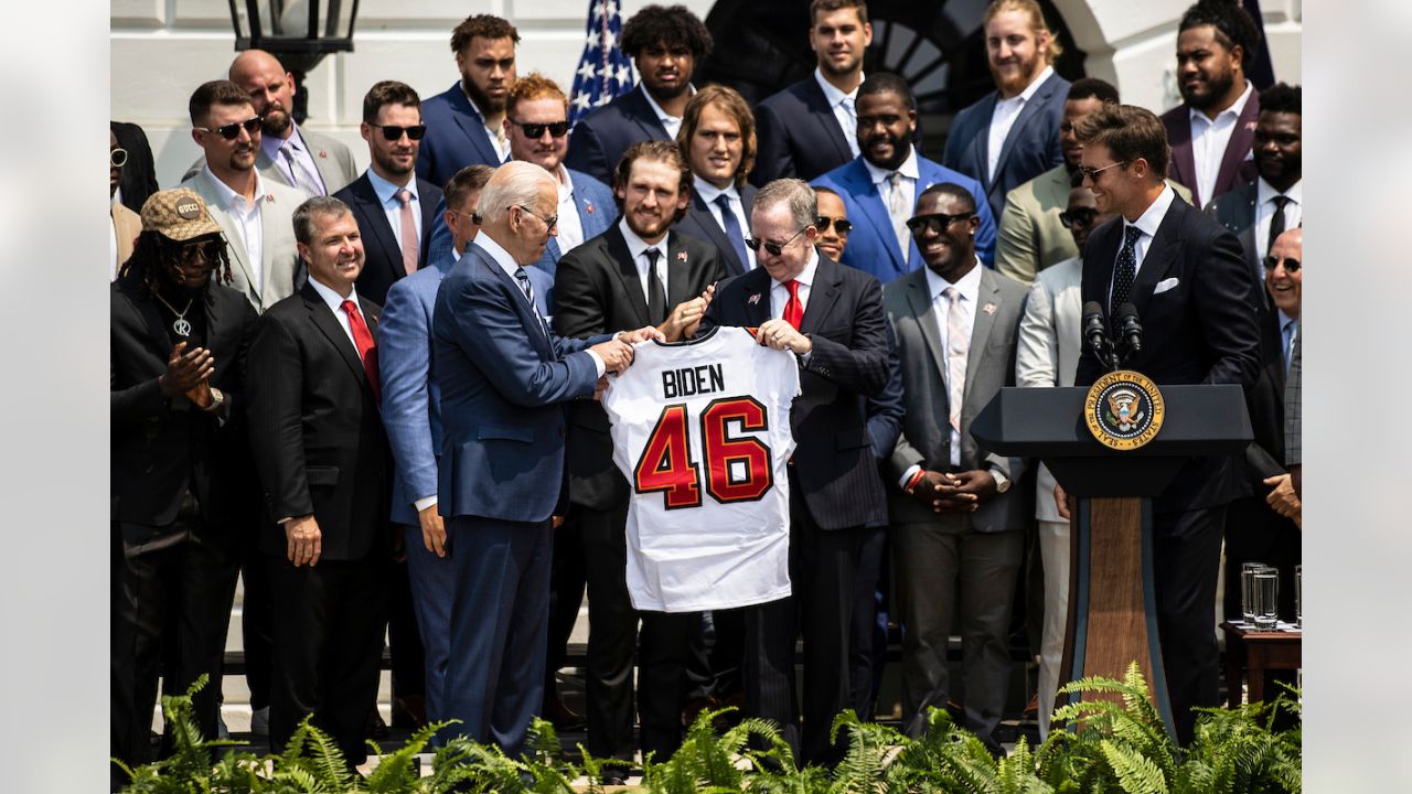 Washington, United States. 20th July, 2021. U.S. President Joe Biden, holds  a number 46 jersey handed to him by Super Bowl Champions Tampa Bay  Buccaneers owner Bryan Glazer, on the South Lawn