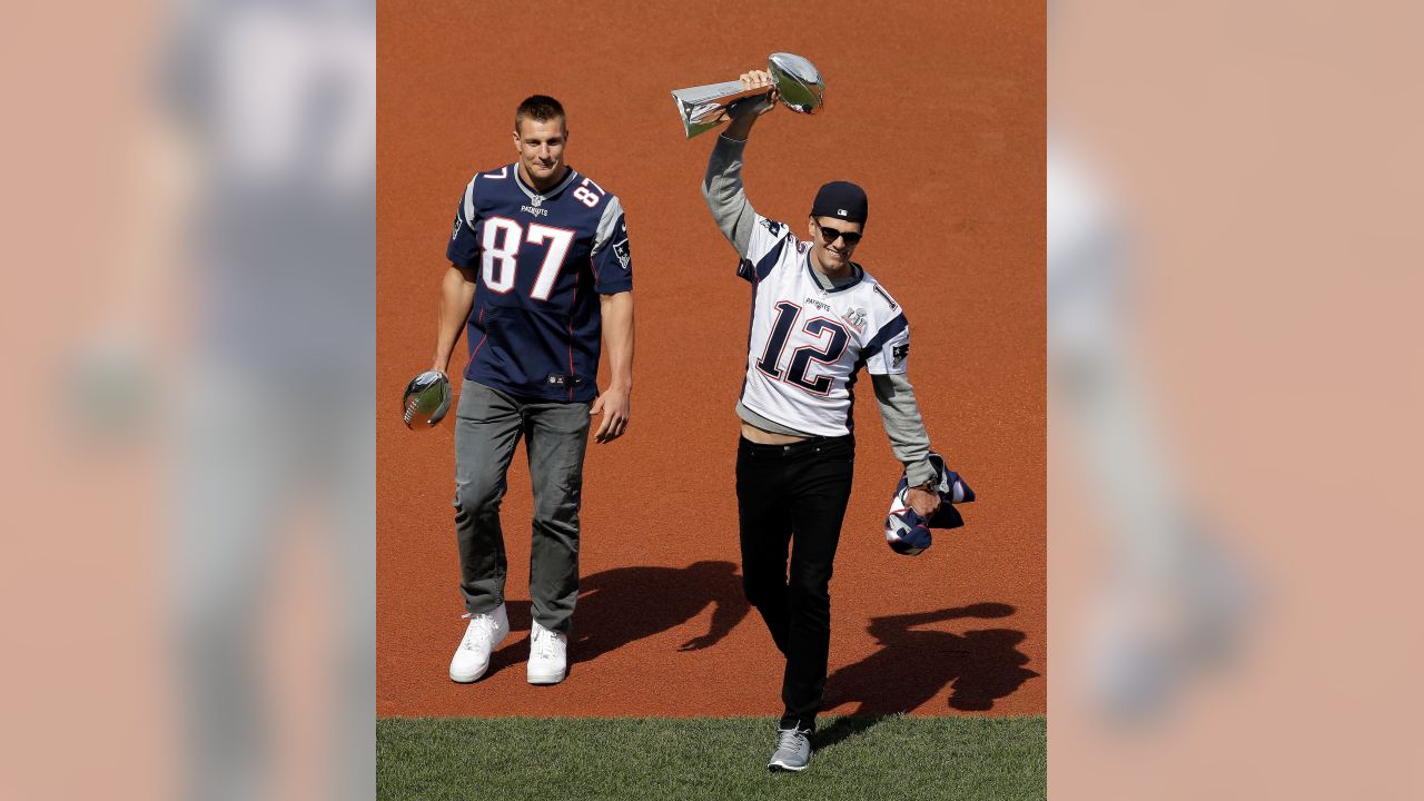 Tom Brady takes batting practice with Rob Gronkowski