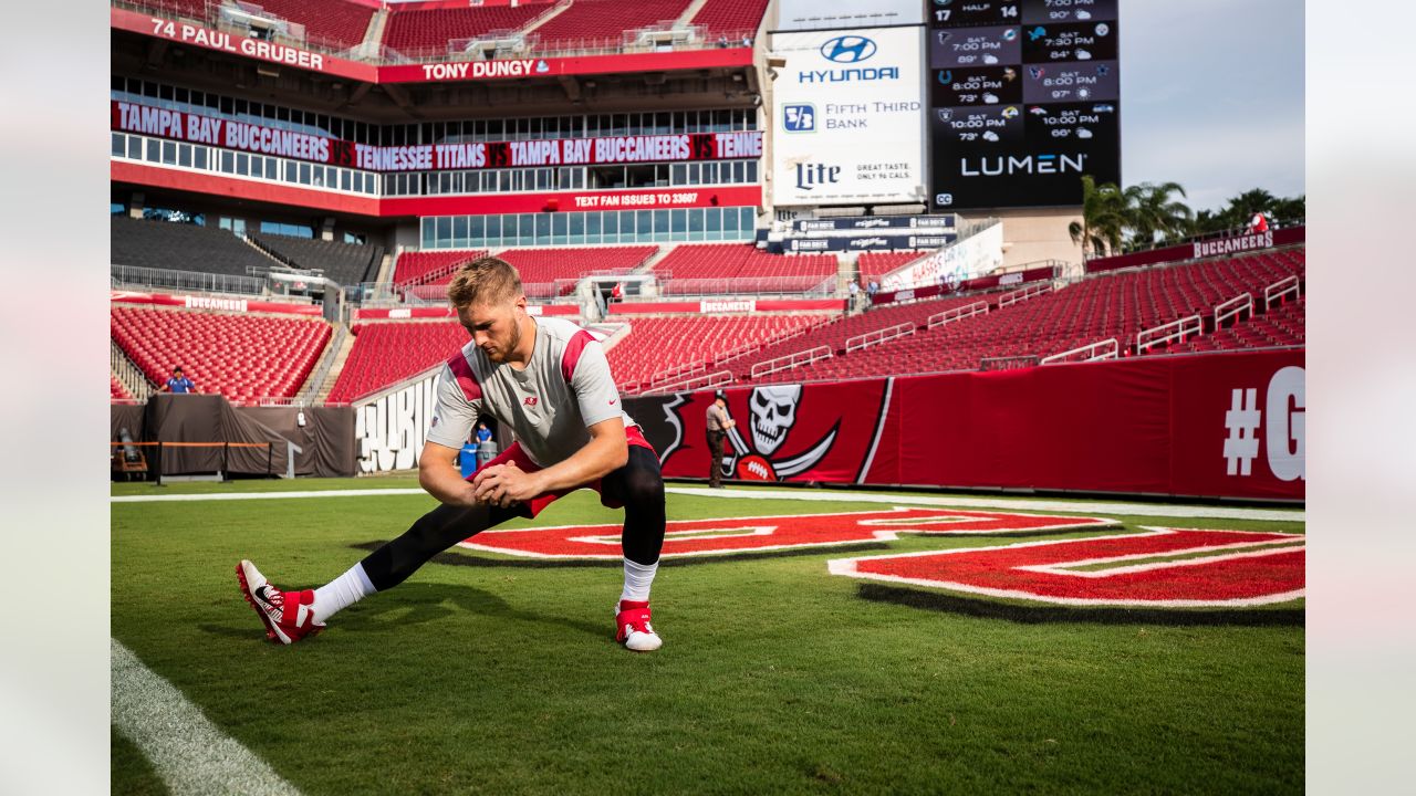 Tampa Bay Buccaneers linebacker Joe Tryon-Shoyinka (9) stretches out prior  to an NFL football game against the New England Patriots, Sunday, Oct. 3,  2021, in Foxborough, Mass. (AP Photo/Greg M. Cooper Stock