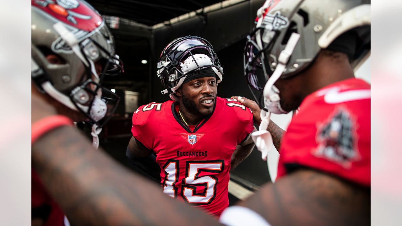 Tampa Bay Buccaneers linebacker Joe Tryon-Shoyinka (9) stretches out prior  to an NFL football game against the New England Patriots, Sunday, Oct. 3,  2021, in Foxborough, Mass. (AP Photo/Greg M. Cooper Stock