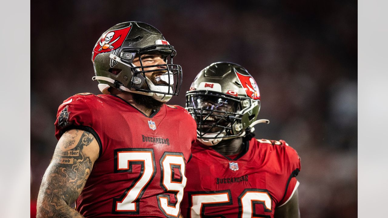 Tampa Bay Buccaneers linebacker Joe Tryon-Shoyinka (9) stretches out prior  to an NFL football game against the New England Patriots, Sunday, Oct. 3,  2021, in Foxborough, Mass. (AP Photo/Greg M. Cooper Stock