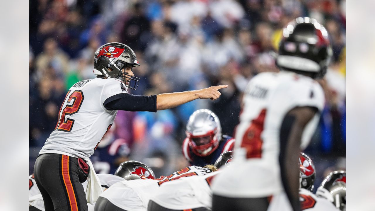 Tampa Bay Buccaneers quarterback Tom Brady (12) puts on his helmet during  the second half of an NFL football game against the New England Patriots,  Sunday, Oct. 3, 2021, in Foxborough, Mass. (