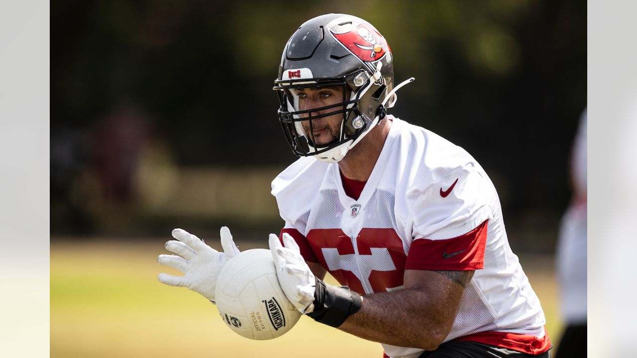 Tackle Brad Seaton (60) and offensive lineman Alex Cappa (65), walk between  drills during Buccaneers rookie minicamp on May 11, 2018 at the Tampa Bay  Buccaneers practice facility in Tampa, Fla. (Monica