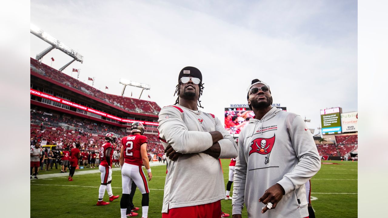 Tampa Bay Buccaneers linebacker Joe Tryon-Shoyinka (9) stretches out prior  to an NFL football game against the New England Patriots, Sunday, Oct. 3,  2021, in Foxborough, Mass. (AP Photo/Greg M. Cooper Stock